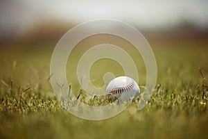 Baseball, pitch and sports ball on grass on an outdoor field for a game, training or practice. Softball, sport and