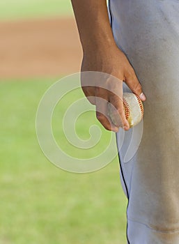 Baseball pitcher holding ball