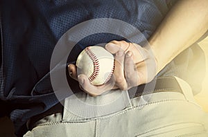 Baseball pitcher ready to pitch. Close up of hand photo
