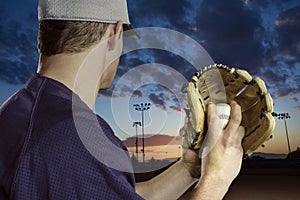 Baseball pitcher ready to pitch in an evening baseball game