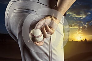 Baseball pitcher ready to pitch in an evening baseball game