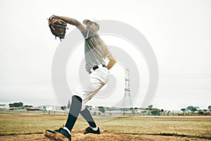 Baseball, pitcher and sports, athlete man and throw a pitch during a competitive game or match on a court. Fitness