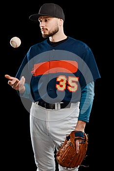 Baseball pitcher throwing ball up