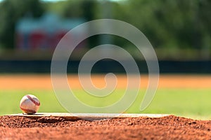 Baseball on pitchers mound photo