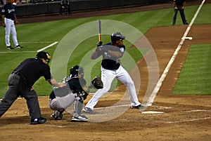 Baseball plate umpire, catcher, batter at work