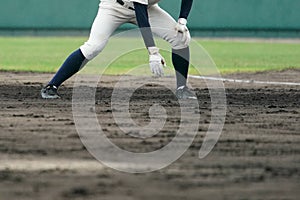 Baseball player attempting to steal a base