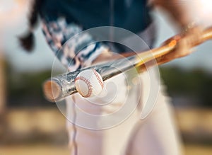 Baseball player, bat and ball while swinging during sports game, match or training outside. Closeup of a fit female