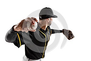 Baseball player, catcher in a black white sports uniform practicing isolated on a white studio background. Back view