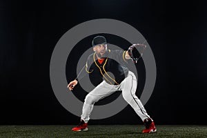 Baseball player on dark background. Ballplayer portrait.