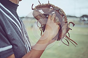 Baseball player, hands or ball in mitt on grass field for fitness, workout and training in game, match and competition