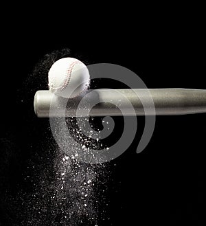 Baseball player hit ball with silver bat and sand soil explode in air. Baseball players in dynamic action hit ball smoke tail.