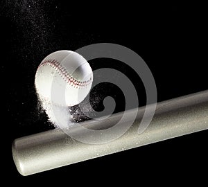 Baseball player hit ball with silver bat and sand soil explode in air. Baseball players in dynamic action hit ball smoke tail.