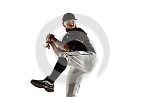 Baseball player, pitcher in a black uniform practicing on a white background.