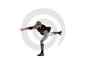 Baseball player, pitcher in a black uniform practicing on a white background.