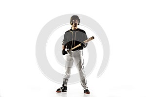 Baseball player, pitcher in a black uniform practicing on a white background.