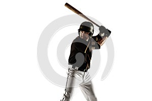 Baseball player, pitcher in a black uniform practicing on a white background.