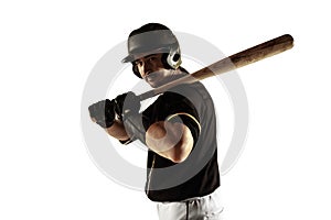 Baseball player, pitcher in a black uniform practicing on a white background.