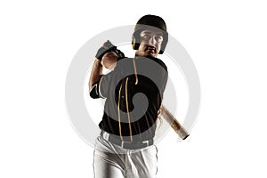 Baseball player, pitcher in a black uniform practicing on a white background.