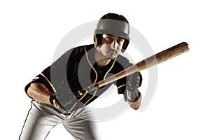 Baseball player, pitcher in a black uniform practicing on a white background.