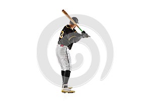 Baseball player, pitcher in a black white sports uniform practicing isolated on a white studio background.