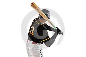 Baseball player, pitcher in a black white sports uniform practicing isolated on a white studio background. Back view