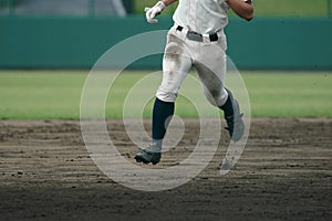 Baseball player running for the next base