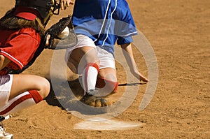 Baseball Player Running Sliding Into Base photo