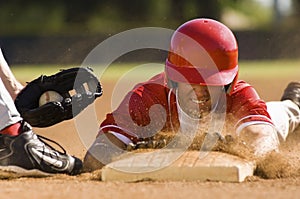 Baseball Player Sliding Into Base photo