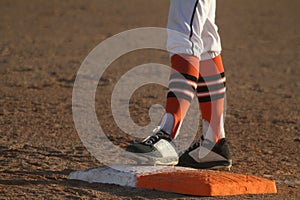 Baseball Player Standing on First Base
