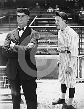 Baseball player and umpire photo