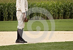 Baseball player in vintage uniform and glove