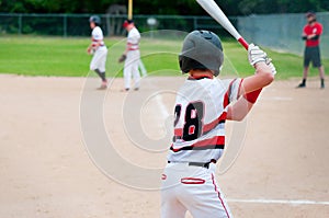 Baseball player waiting for pitch.