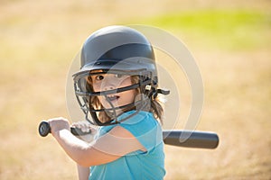 Baseball players kid swinging the bat at a fastball from the pitcher.