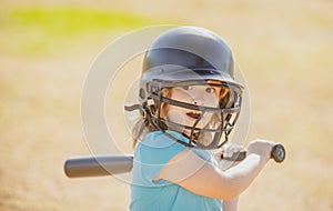 Baseball players kid swinging the bat at a fastball from the pitcher. photo