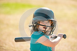 Baseball players kid swinging the bat at a fastball from the pitcher. photo