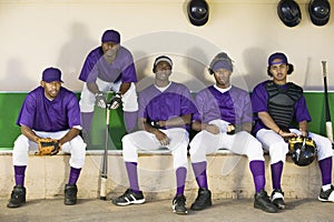 Baseball Players Sitting In Dugout