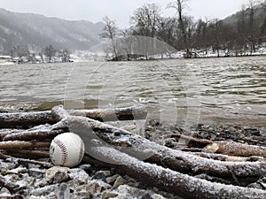 A baseball on the river banks of West Virginia photo