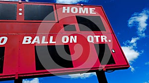 Baseball Scoreboard Competition with Blue Sky and Clouds