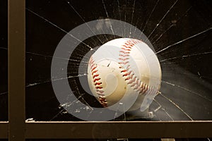 Baseball smashing window photo