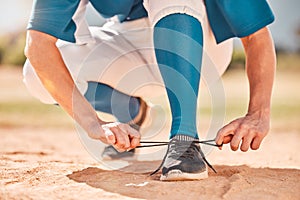 Baseball sport and shoes lace tie preparation for fitness athlete on sand field for tournament. Softball girl with