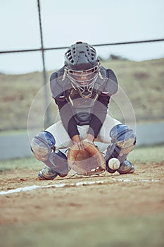 Baseball, sports and ball with a catcher on a grass pitch or field during a game or match outdoor. Fitness, exercise and