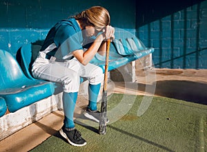Baseball, sports bench and woman athlete angry thinking of game loss while waiting to play. Frustrated, sad and serious