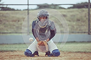 Baseball, sports and catch a ball with a man athlete or catcher on a field during a game or match. Fitness, exercise and