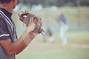 Baseball, sports and a pitcher throwing a ball during a competitive game or match on a grass pitch field. Fitness