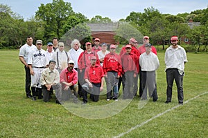 Baseball team in 19th century vintage uniform during old style base ball play following the rules and customs from 1864