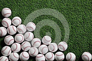 Baseballs on a green turf background