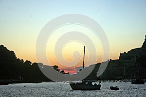 Baseboats in front of Portovenere at sunset