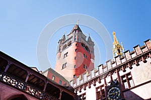 Basel Rathaus tower and steeple against blue sky