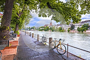 Basel. Rhine river green waterfront and Basel Minster view