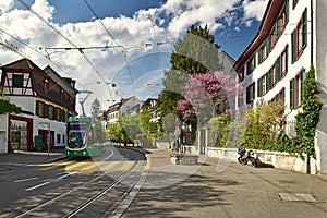 Green tram on the Leonhardsgraben street. Grossbasel district, city of Basel, Switzerland, Europe